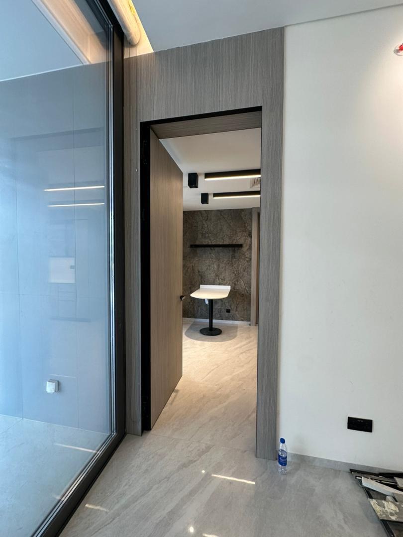 View into the kitchen through the full-height door from the adjoining room