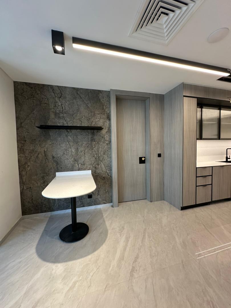 Staron table and shelf against the feature wall